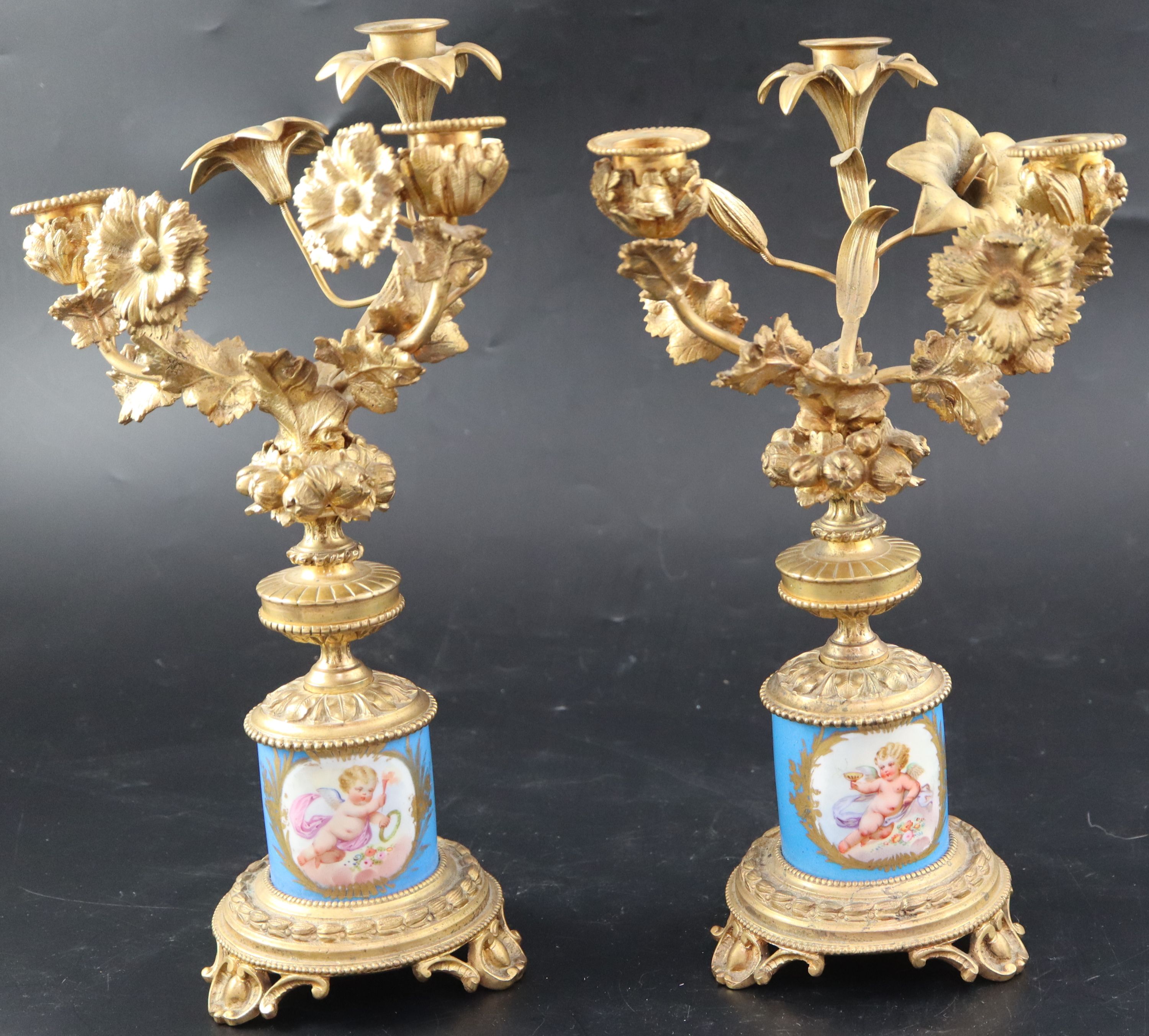 A pair of 19th century French ormolu and Sevres style porcelain three light candelabra, height 32cm